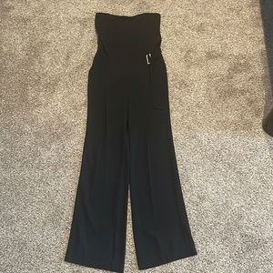 Rachel Roy black wide leg strapless jumpsuit. Wide legs and pockets.
